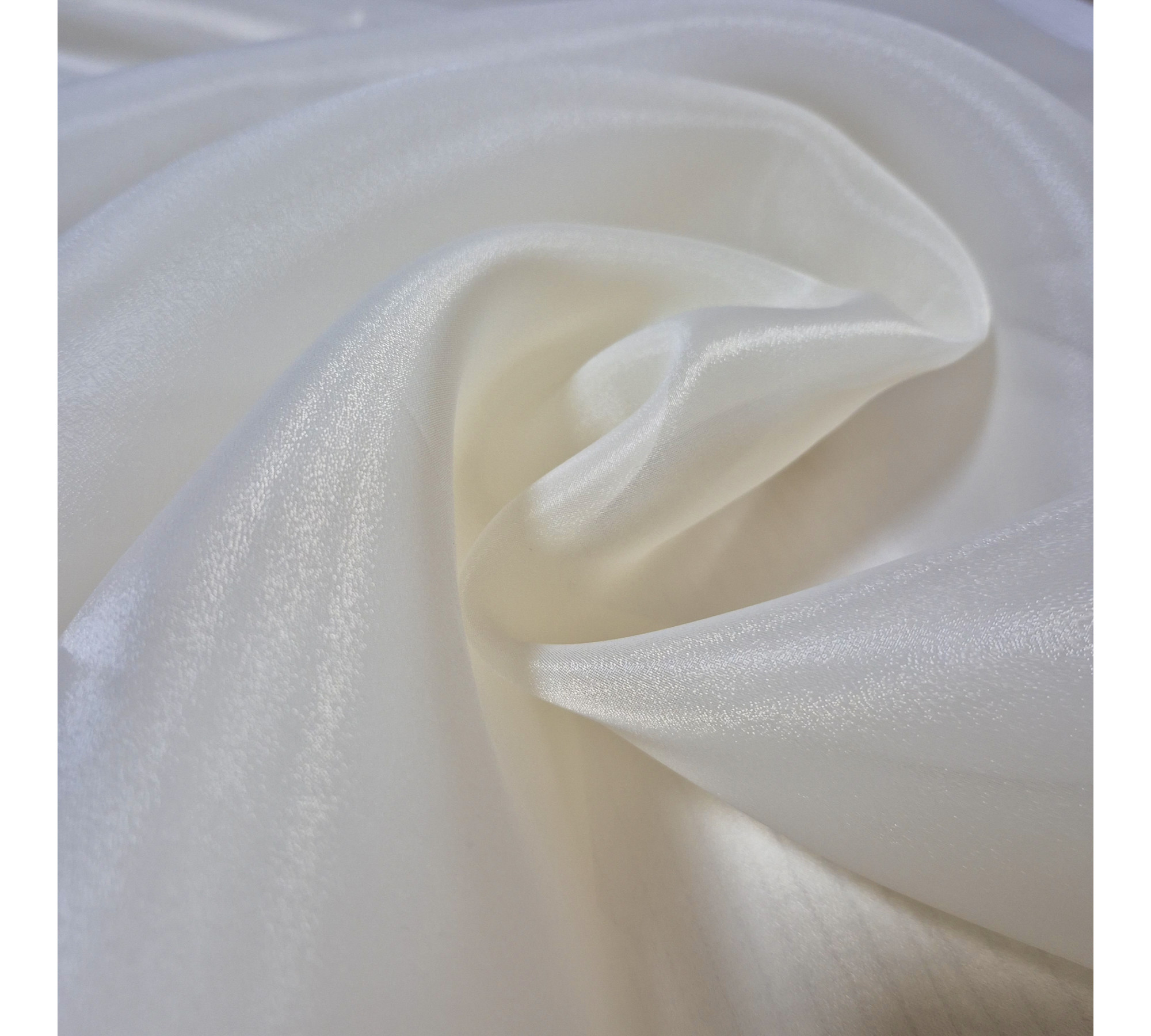 Beige asymmetrical blouse a high neck, made of translucent organza.