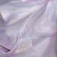 Beige asymmetrical blouse a high neck, made of translucent organza.