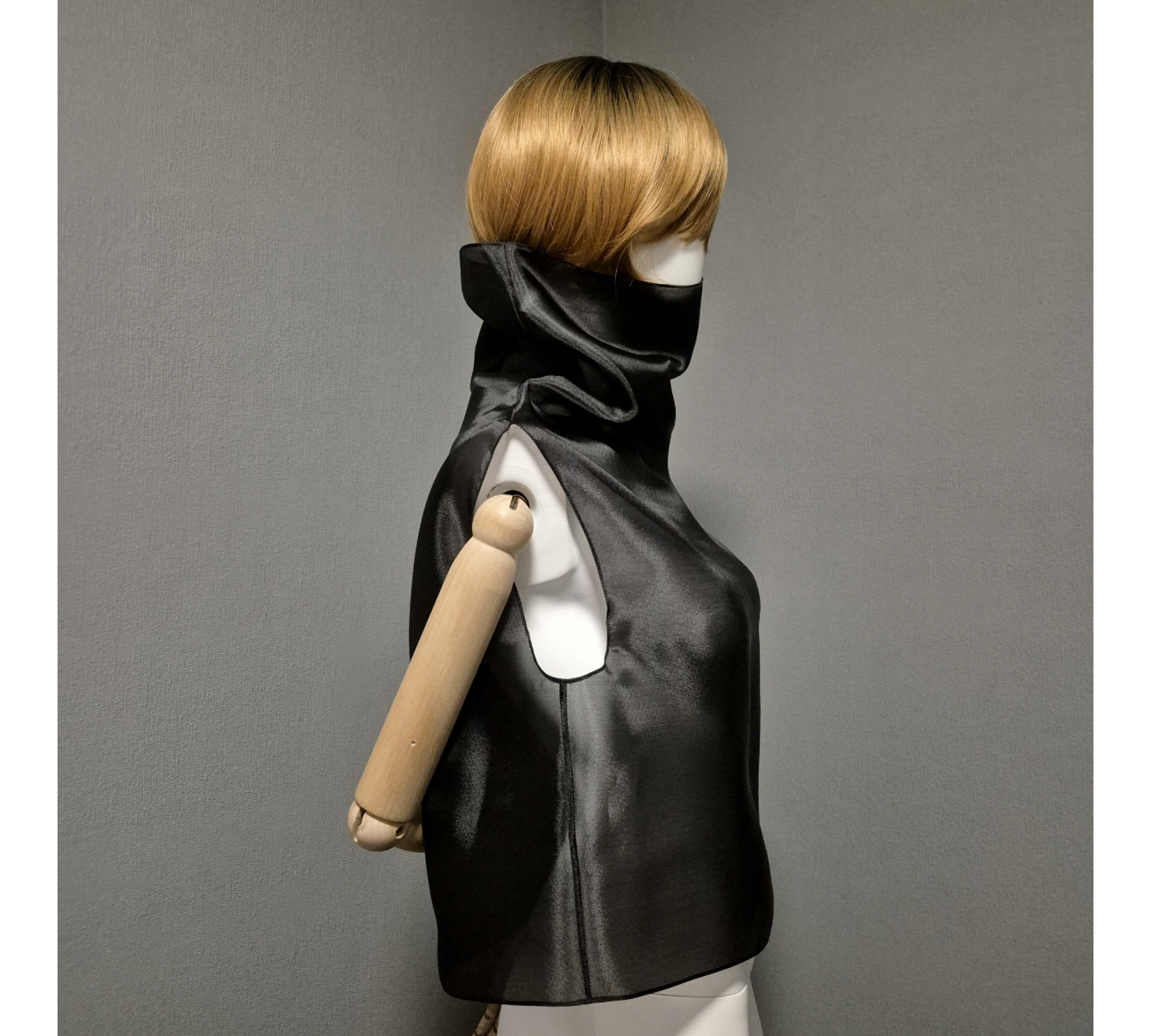 Black gothic style belted blouse a high neck, made of translucent organza.