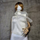 Beige asymmetrical blouse a high neck, made of translucent organza.