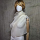 Beige asymmetrical blouse a high neck, made of translucent organza.