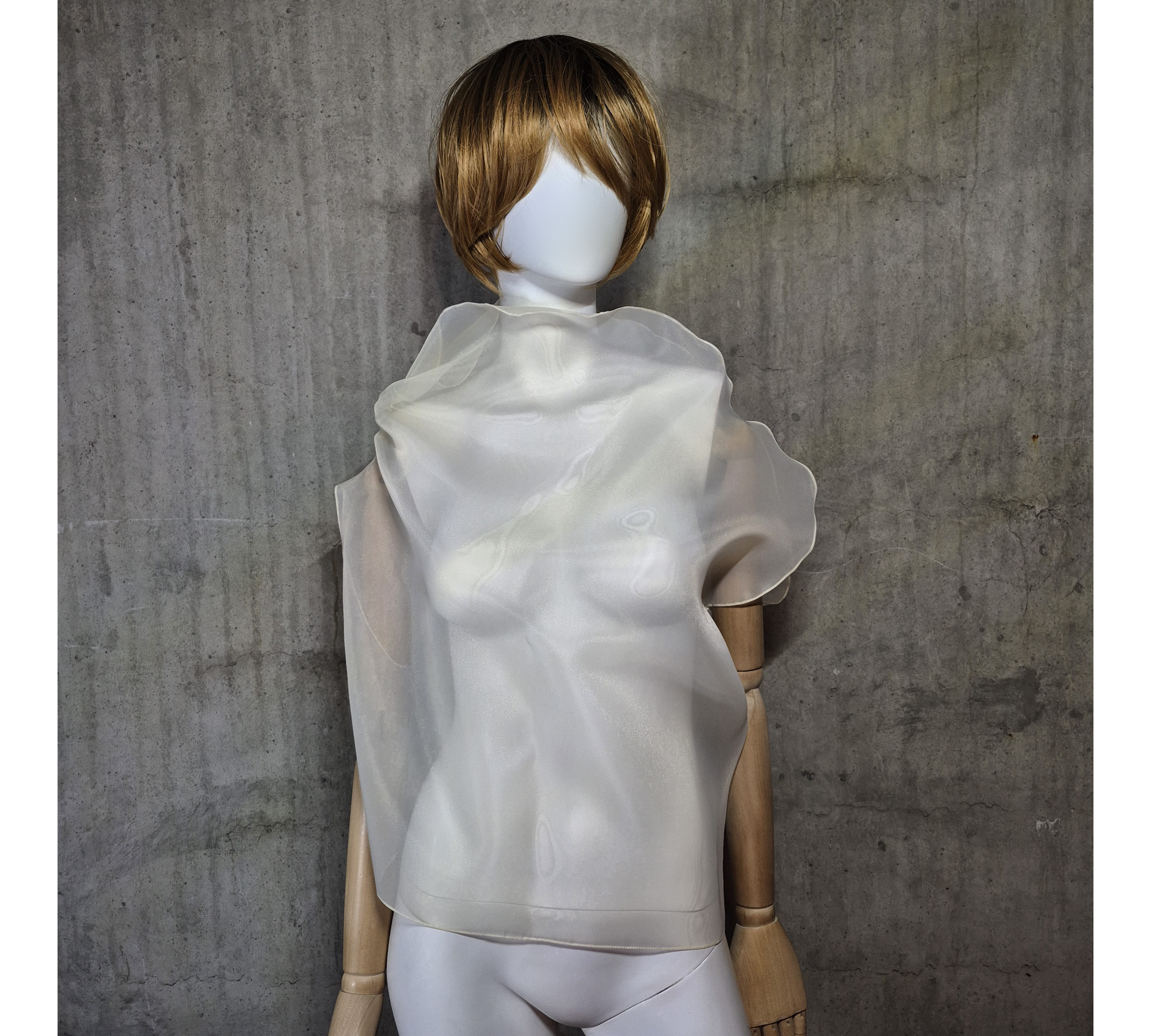 Beige asymmetrical blouse a high neck, made of translucent organza.
