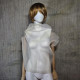 Beige asymmetrical blouse a high neck, made of translucent organza.