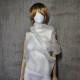 Beige asymmetrical blouse a high neck, made of translucent organza.
