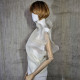 Beige asymmetrical blouse a high neck, made of translucent organza.
