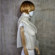Beige asymmetrical blouse a high neck, made of translucent organza.