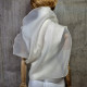 Beige asymmetrical blouse a high neck, made of translucent organza.