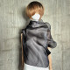 Black asymmetrical blouse a high neck, made of translucent organza.