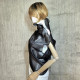 Black asymmetrical blouse a high neck, made of translucent organza.