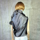Black asymmetrical blouse a high neck, made of translucent organza.