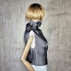 Black asymmetrical blouse a high neck, made of translucent organza.