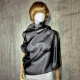 Black asymmetrical blouse a high neck, made of translucent organza.