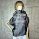 Black asymmetrical blouse a high neck, made of translucent organza.