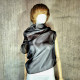 Black asymmetrical blouse a high neck, made of translucent organza.
