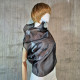 Black asymmetrical blouse a high neck, made of translucent organza.