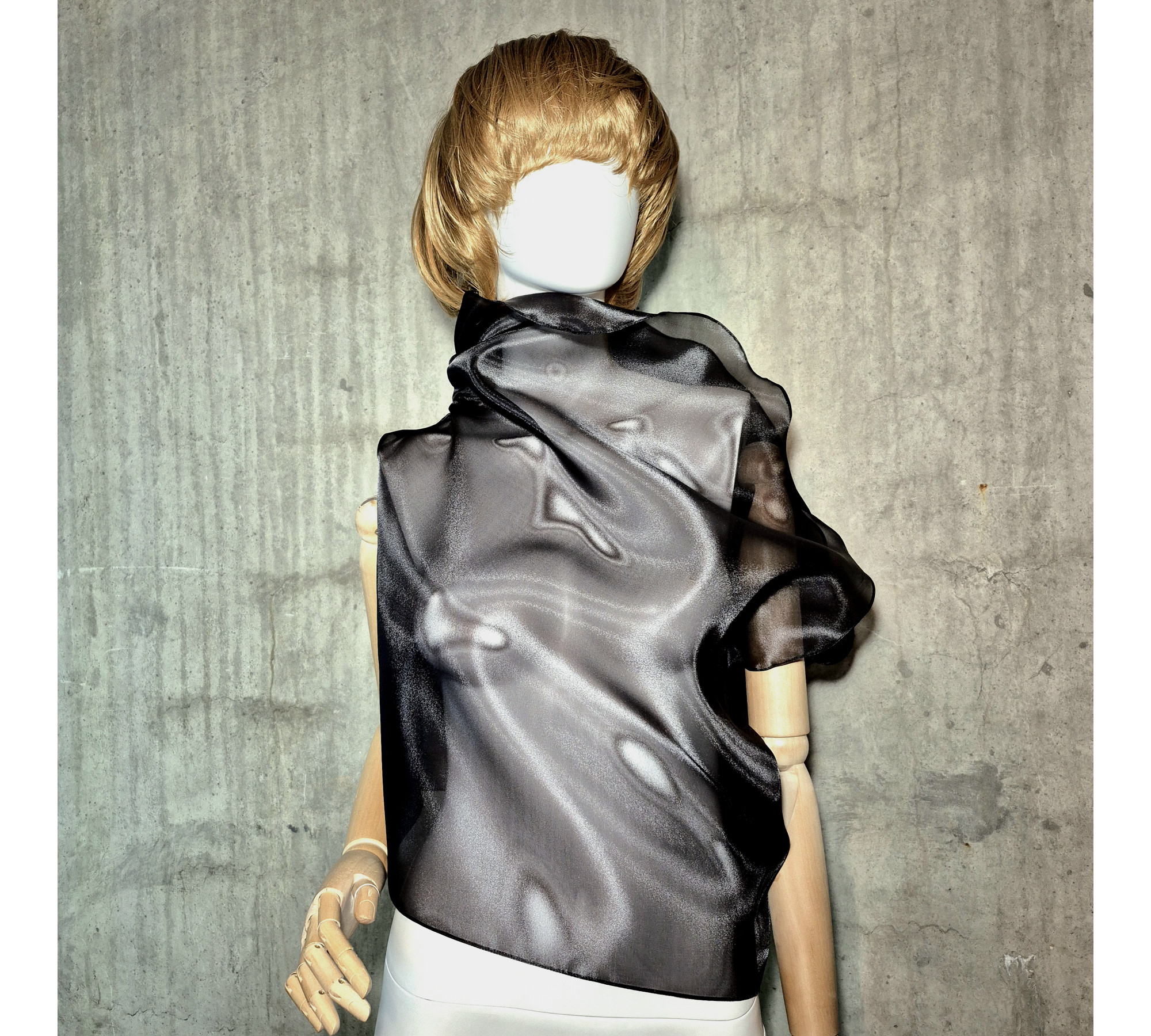 Black asymmetrical blouse a high neck, made of translucent organza. Black asymmetrical blouse a high neck, made of translucent organza.