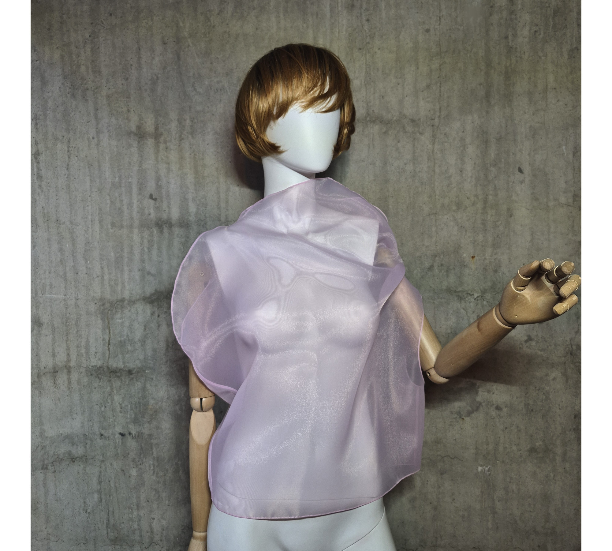 Pink asymmetrical blouse a high neck, made of translucent organza.