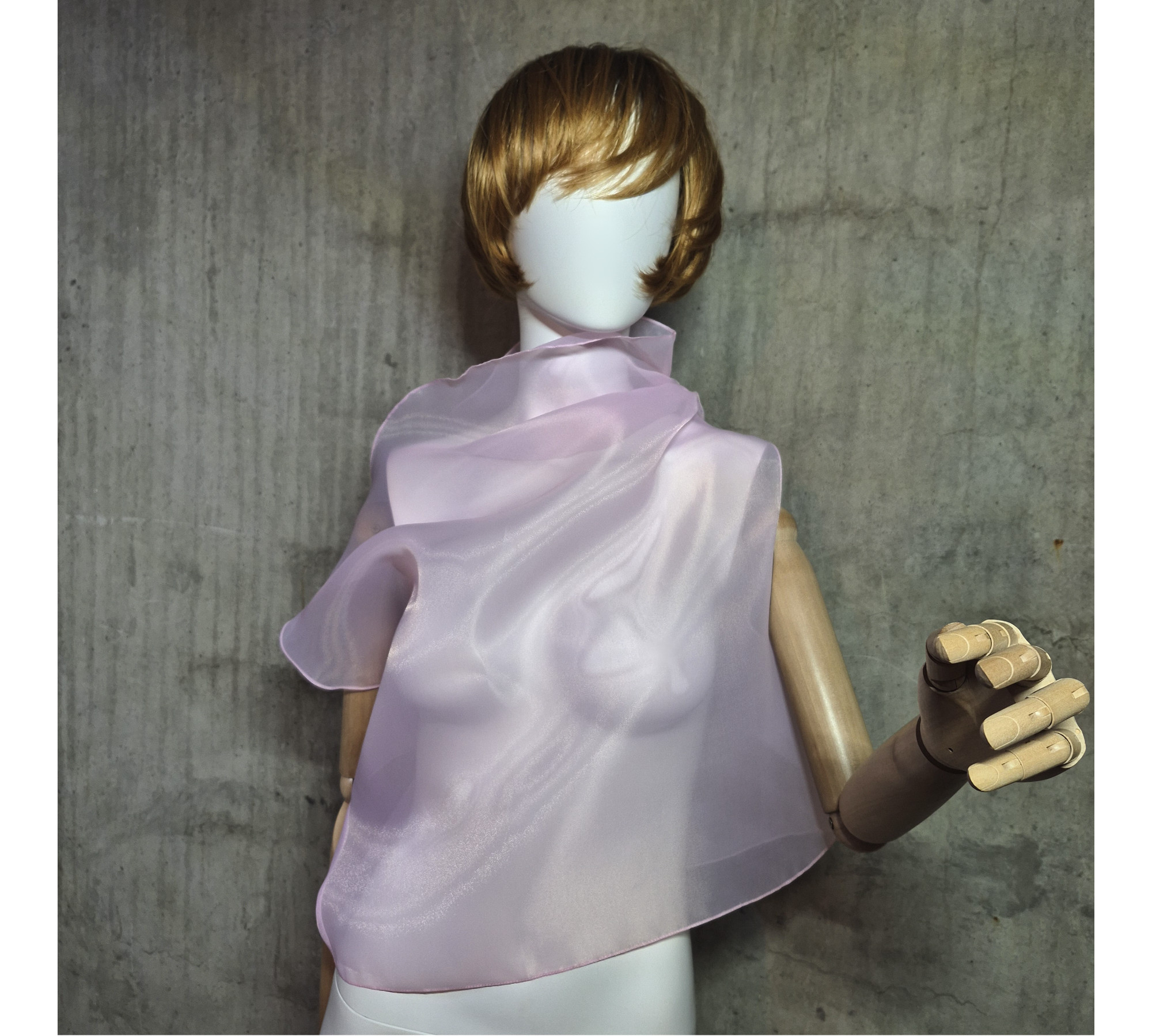 Pink asymmetrical blouse a high neck, made of translucent organza.