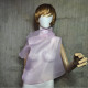 Pink asymmetrical blouse a high neck, made of translucent organza.