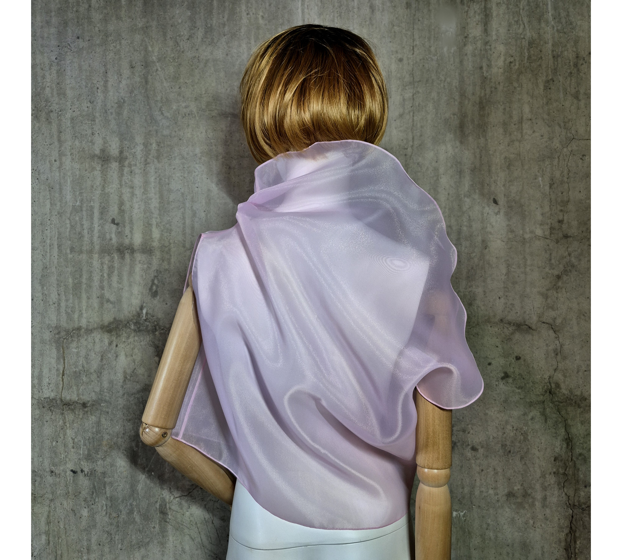 Pink asymmetrical blouse a high neck, made of translucent organza.
