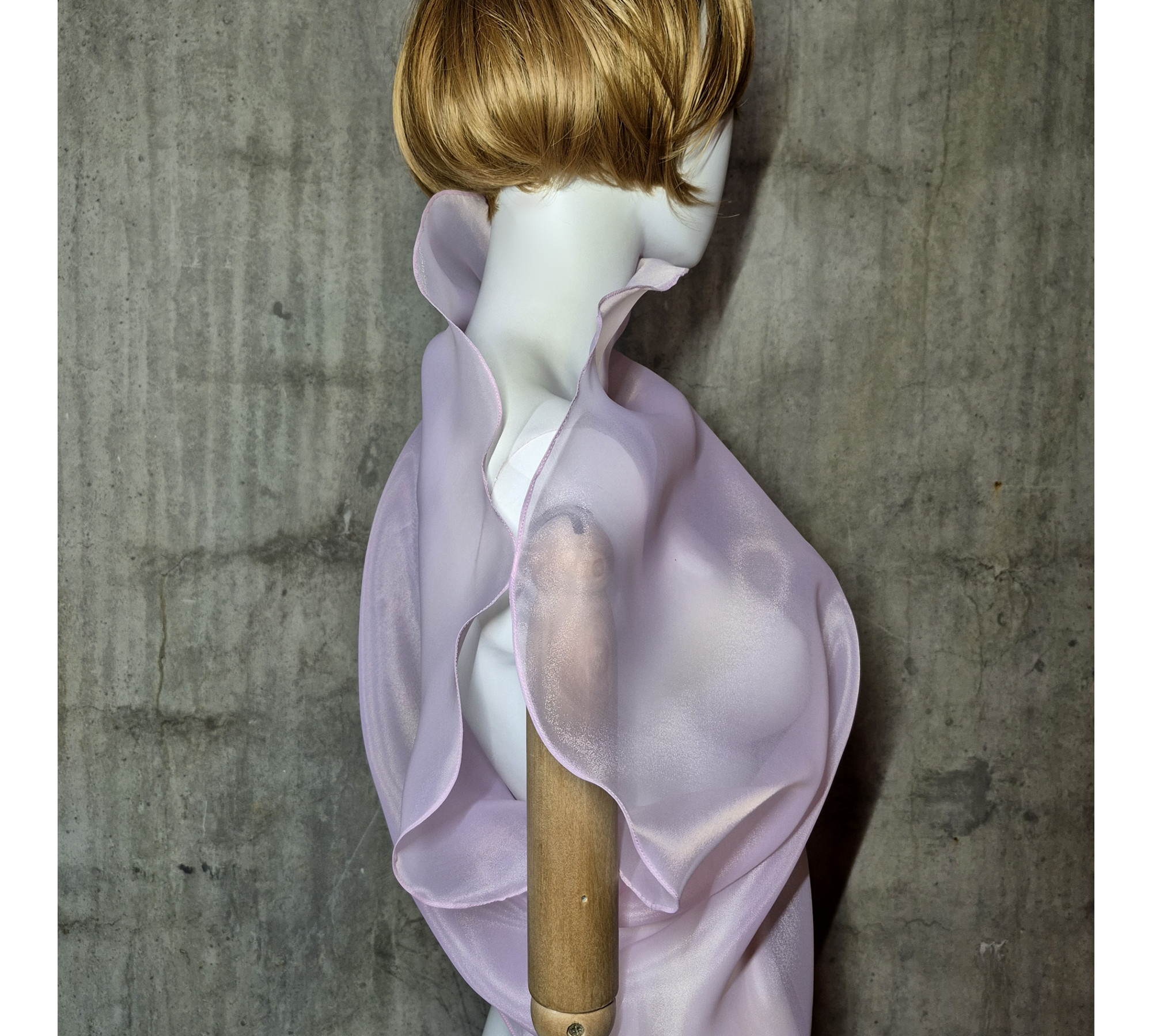 Pink asymmetrical blouse a high neck, made of translucent organza.