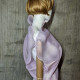Pink asymmetrical blouse a high neck, made of translucent organza.