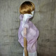 Pink asymmetrical blouse a high neck, made of translucent organza.