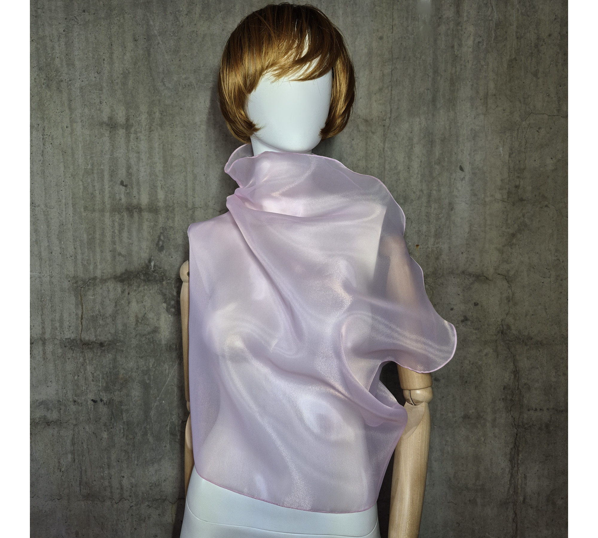 Pink asymmetrical blouse a high neck, made of translucent organza.