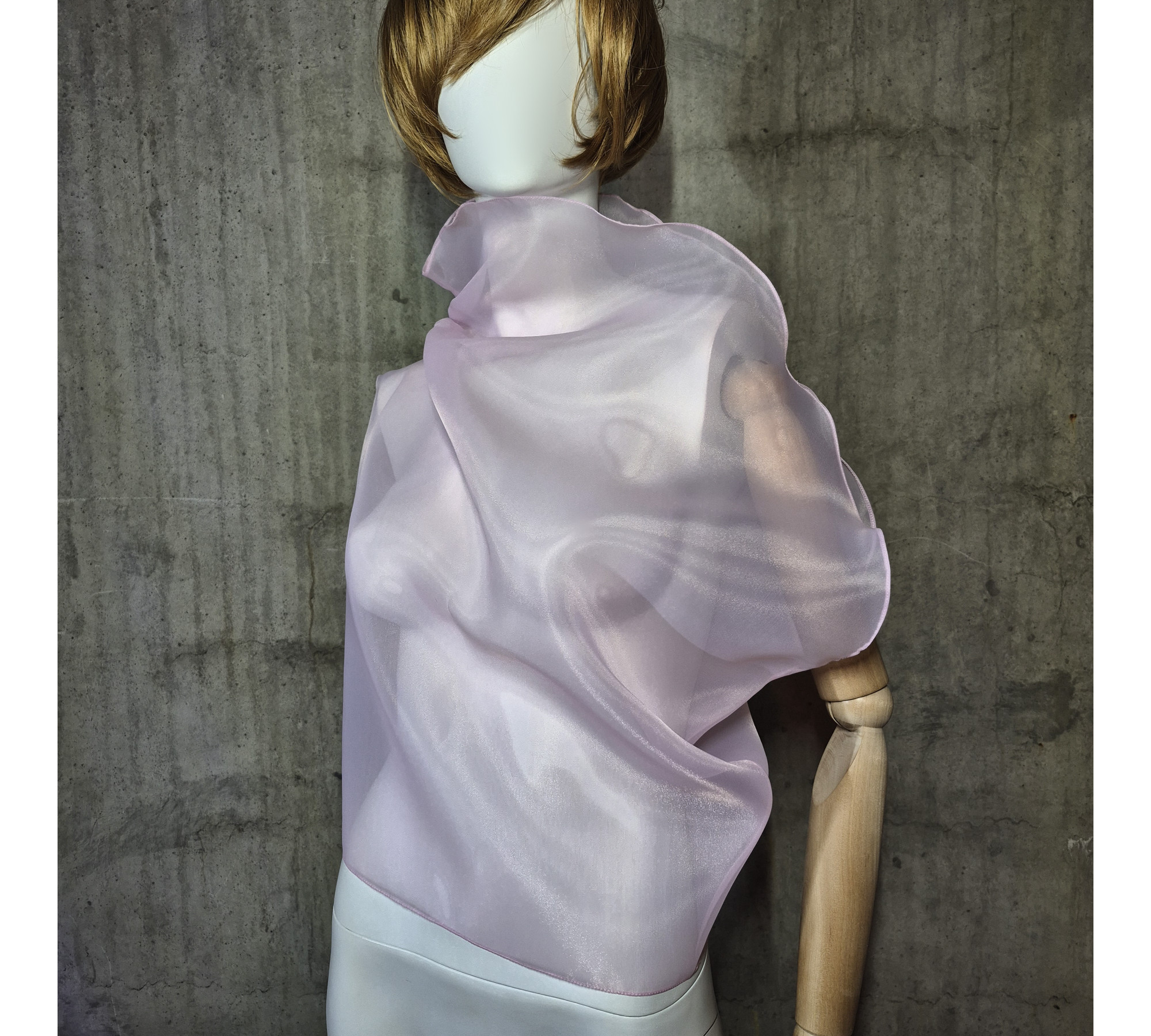 Pink asymmetrical blouse a high neck, made of translucent organza.