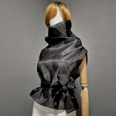 Black sleeveless belted blouse a high neck. Black sleeveless belted blouse a high neck.