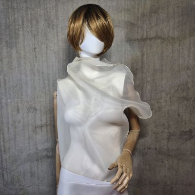 Beige sleeveless belted blouse a high neck.
